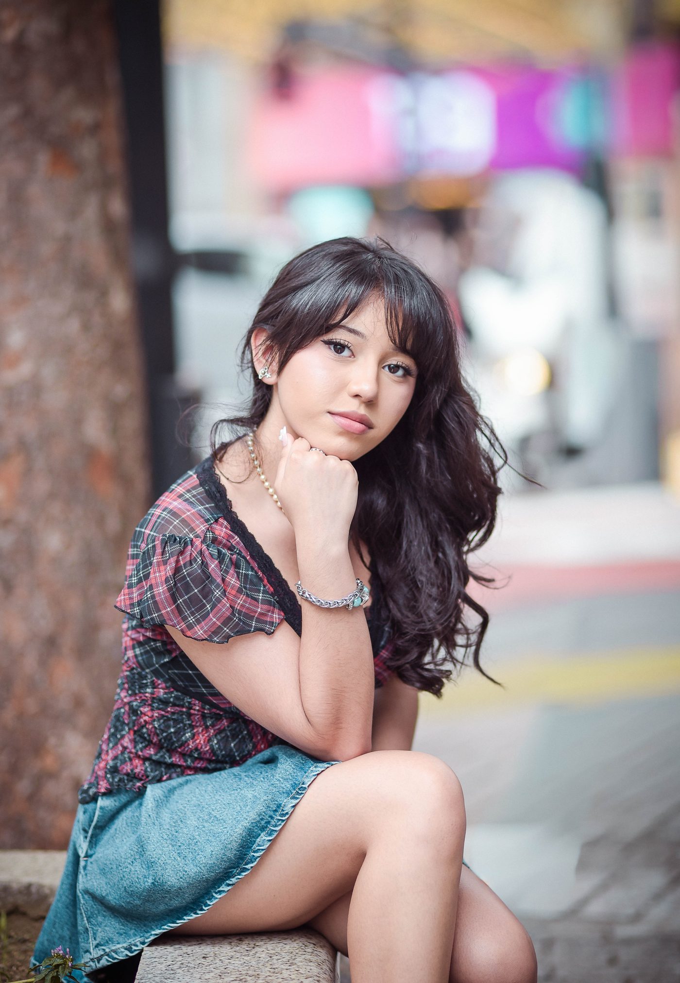 Arianna seated on a bench in Tokyo